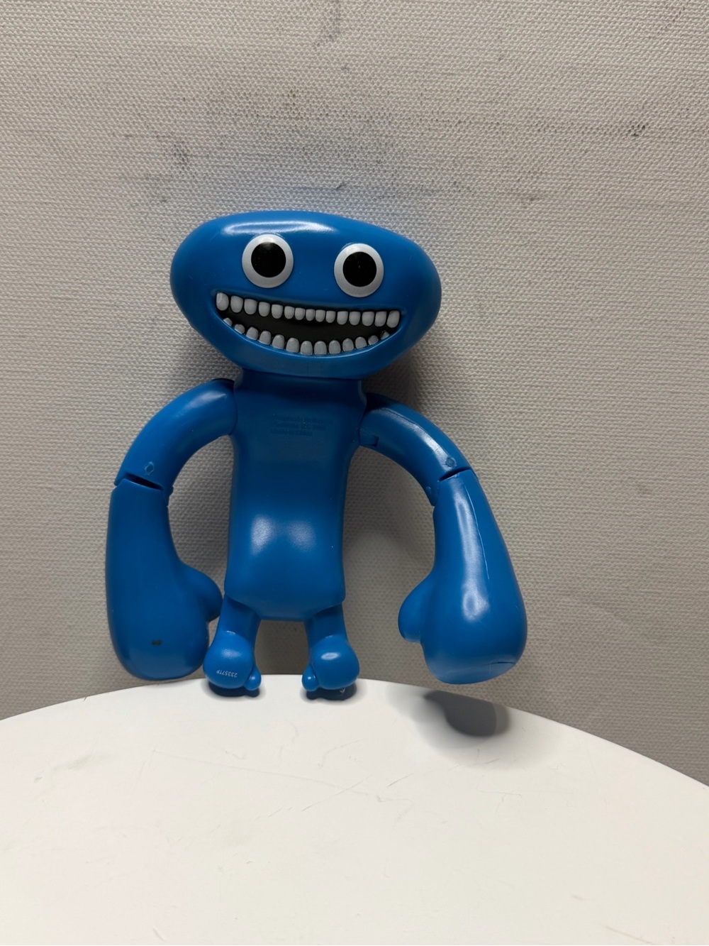 A collectible blue Jumbo Josh figure from Series 2 of the horror game *Garten of